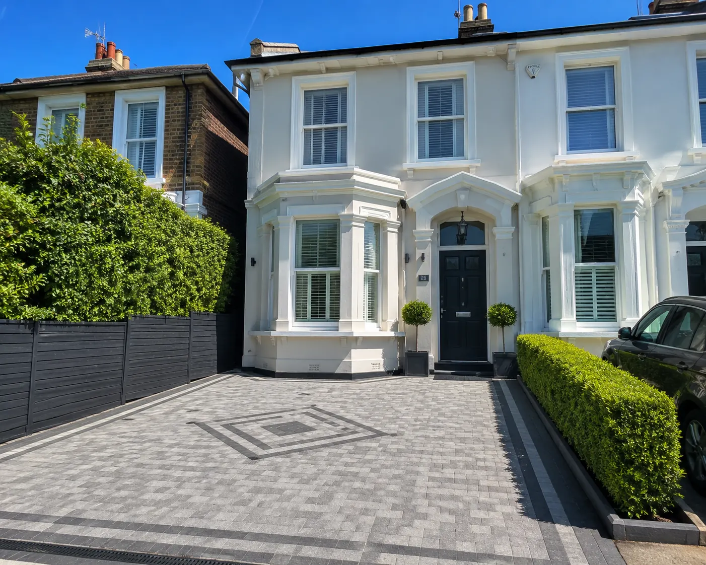 After — Silver-grey block driveway with diamond feature