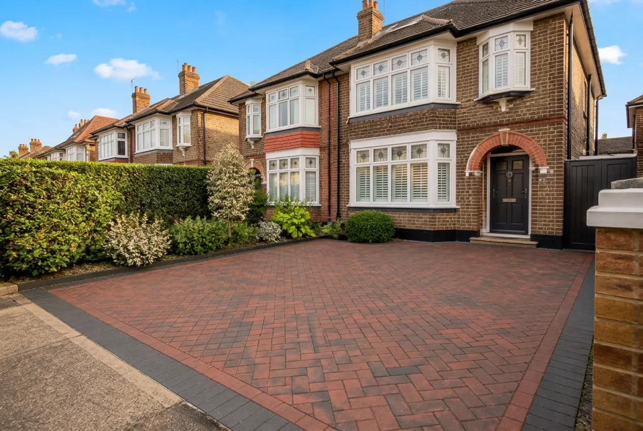 After — Brindle herringbone block-paved driveway